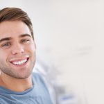 man smiling at dentist