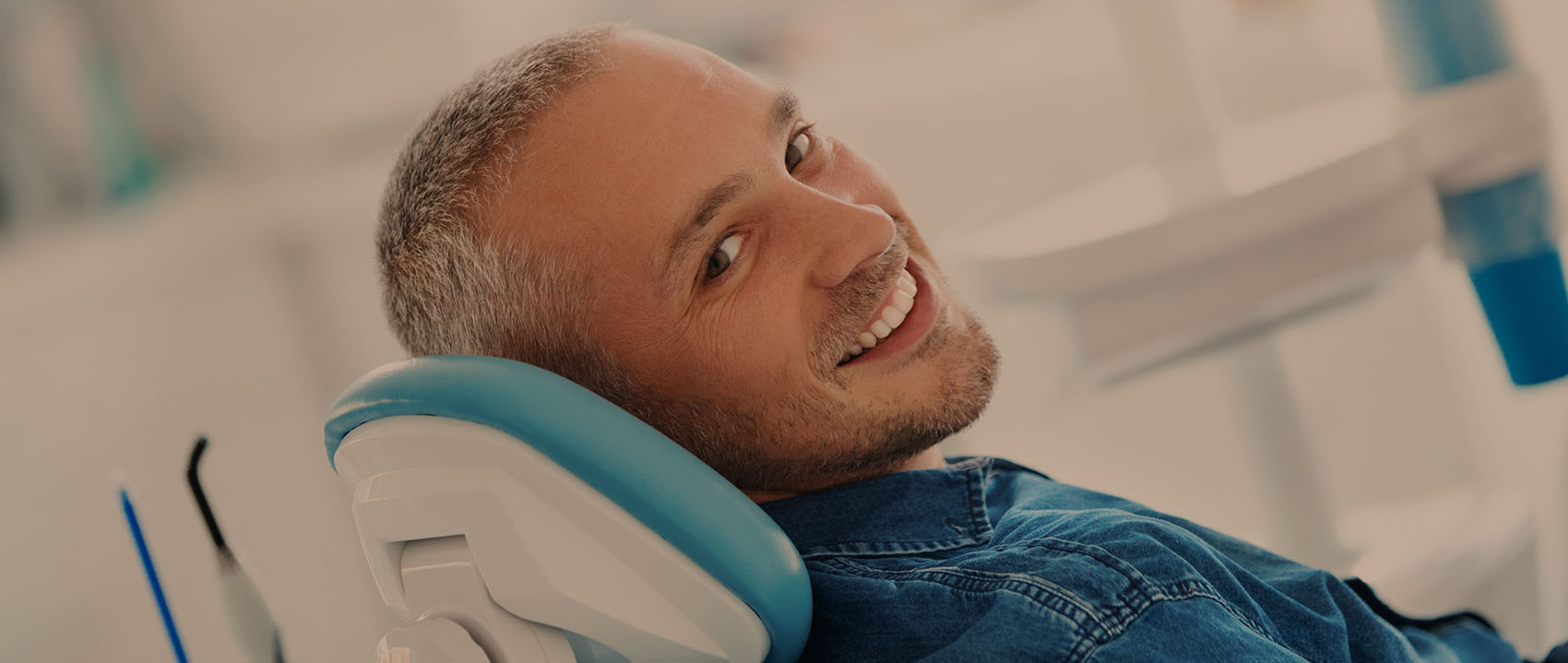 man smiling during dental appointment